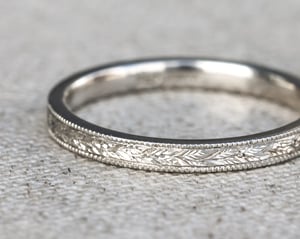 Image of Platinum 2mm flat court, laurel leaf and milled edge engraved ring