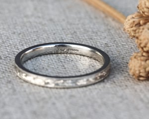 Image of Platinum 2mm flat court, laurel leaf and milled edge engraved ring