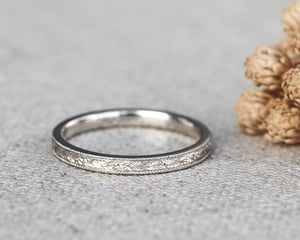 Image of Platinum 2mm flat court, laurel leaf and milled edge engraved ring