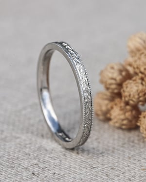 Image of Platinum 2mm flat court, laurel leaf and milled edge engraved ring