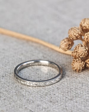 Image of Platinum 2mm flat court, laurel leaf and milled edge engraved ring