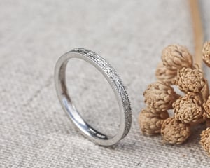 Image of Platinum 2mm flat court, laurel leaf and milled edge engraved ring