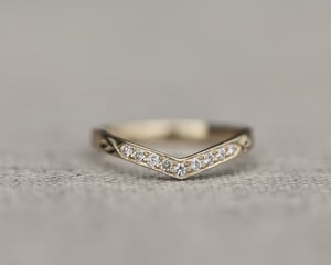 Image of 18ct Yellow gold white diamond set wishbone semi-eternity ring