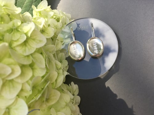 Image of silver earrings with rock crystals