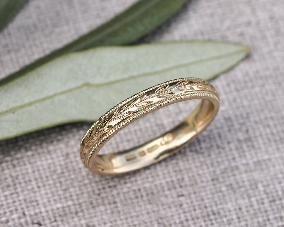 Image of 18ct yellow gold 3mm ‘Olive leaf’ and milled edge engraved ring