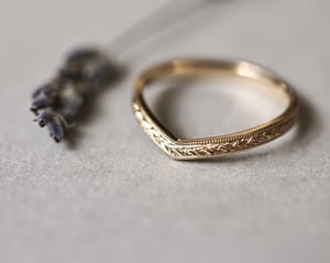 Image of 18ct Yellow gold, 2mm flat court laurel leaf and milled edge engraved wishbone ring