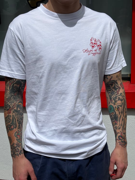 Image of Red and white tee