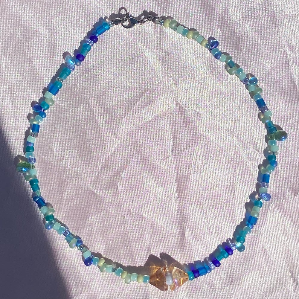 Image of sea shell necklaces (pastel centers)