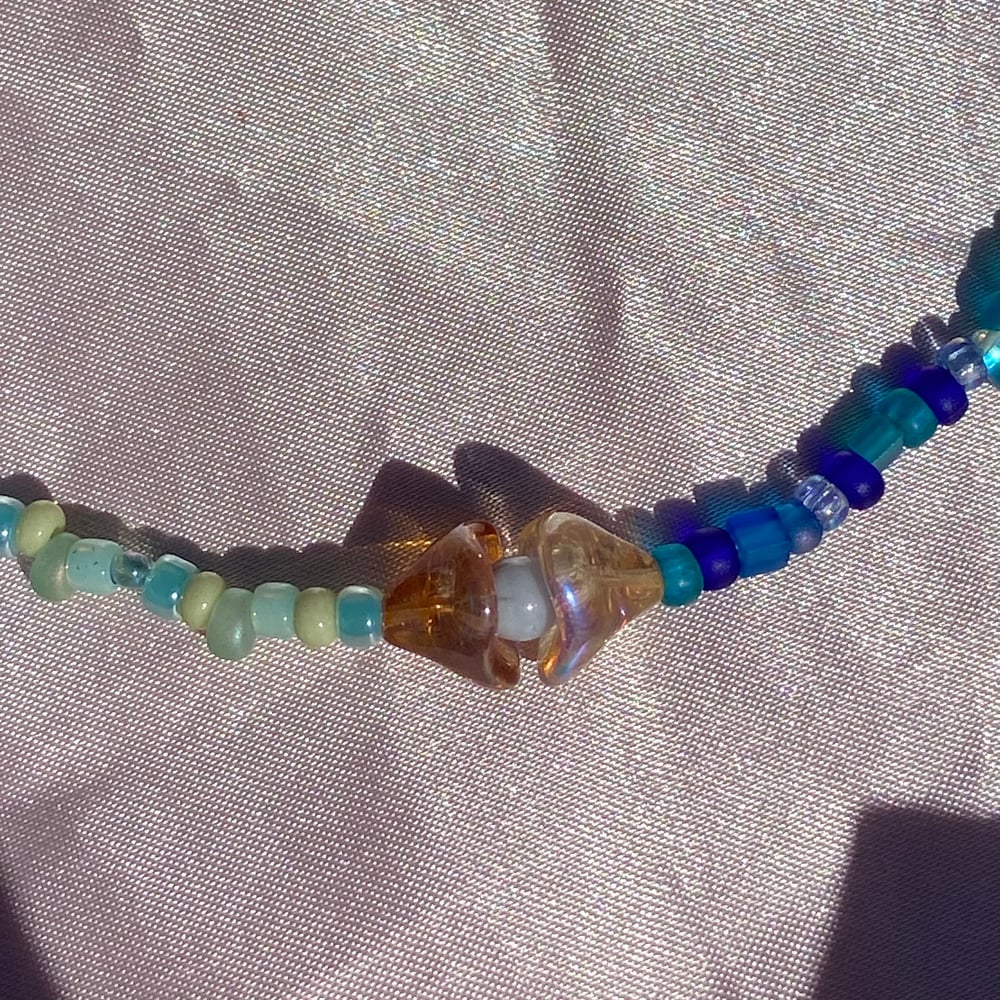 Image of sea shell necklaces (pastel centers)