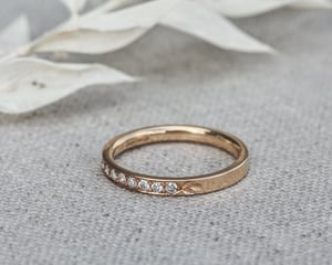 Image of 18ct yellow gold white diamond semi eternity ring