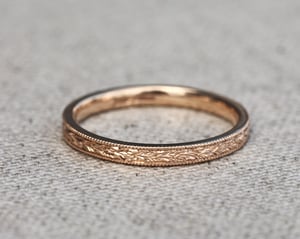 Image of 18ct rose gold, 2mm flat court, laurel leaf and milled edge engraved ring