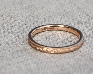 Image of 18ct rose gold, 2mm flat court, laurel leaf and milled edge engraved ring