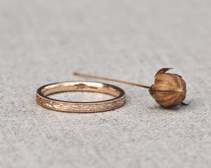 Image of 18ct rose gold, 2mm flat court, laurel leaf and milled edge engraved ring