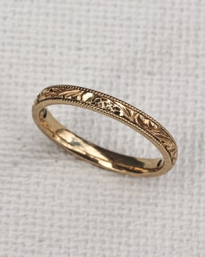 Image of 18ct Yellow gold, 2mm flat court, Floral and milled edge engraved ring