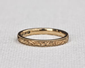 Image of 18ct Yellow gold, 2mm flat court, Floral and milled edge engraved ring