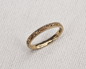 Image of 18ct Yellow gold, 2mm flat court, Floral and milled edge engraved ring