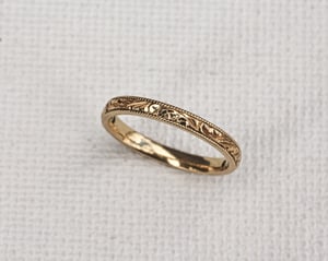 Image of 18ct Yellow gold, 2mm flat court, Floral and milled edge engraved ring