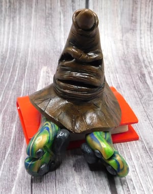 Image of Rubeus the Mini Mon and Sorting Hat