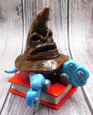 Image of Godric the Mini Mon and Sorting Hat