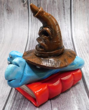 Image of Godric the Mini Mon and Sorting Hat