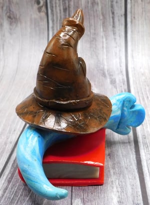 Image of Godric the Mini Mon and Sorting Hat