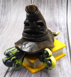 Image of Newt the Mini Mon and Sorting Hat