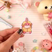 Image 1 of Small Pink Raincoat Mudkip Axolotl Vinyl Sticker