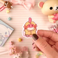Image 2 of Small Pink Raincoat Mudkip Axolotl Vinyl Sticker