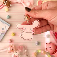 Image 1 of Acrylic Glitter Pink Cinna Cinnamon Roll Puppy Keychain