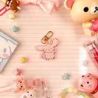 Image 2 of Acrylic Glitter Pink Cinna Cinnamon Roll Puppy Keychain