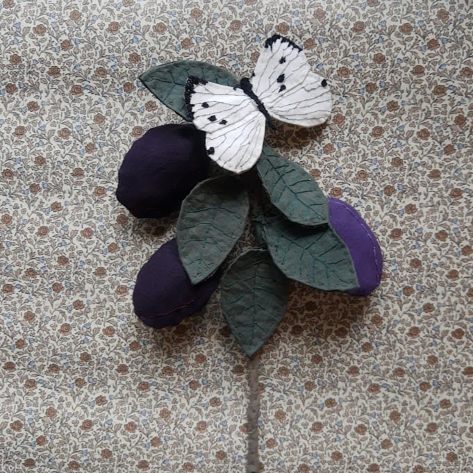 Image of Plum branch with butterfly