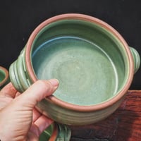 Image 1 of HANDLED SERVING DISH - Jade on warm clay