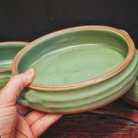 Image 1 of HANDLED SERVING DISH - Jade on warm clay (MED)