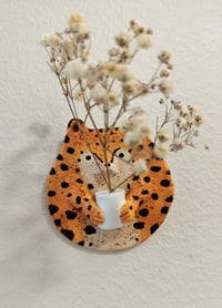 Image 1 of Leopard and vase