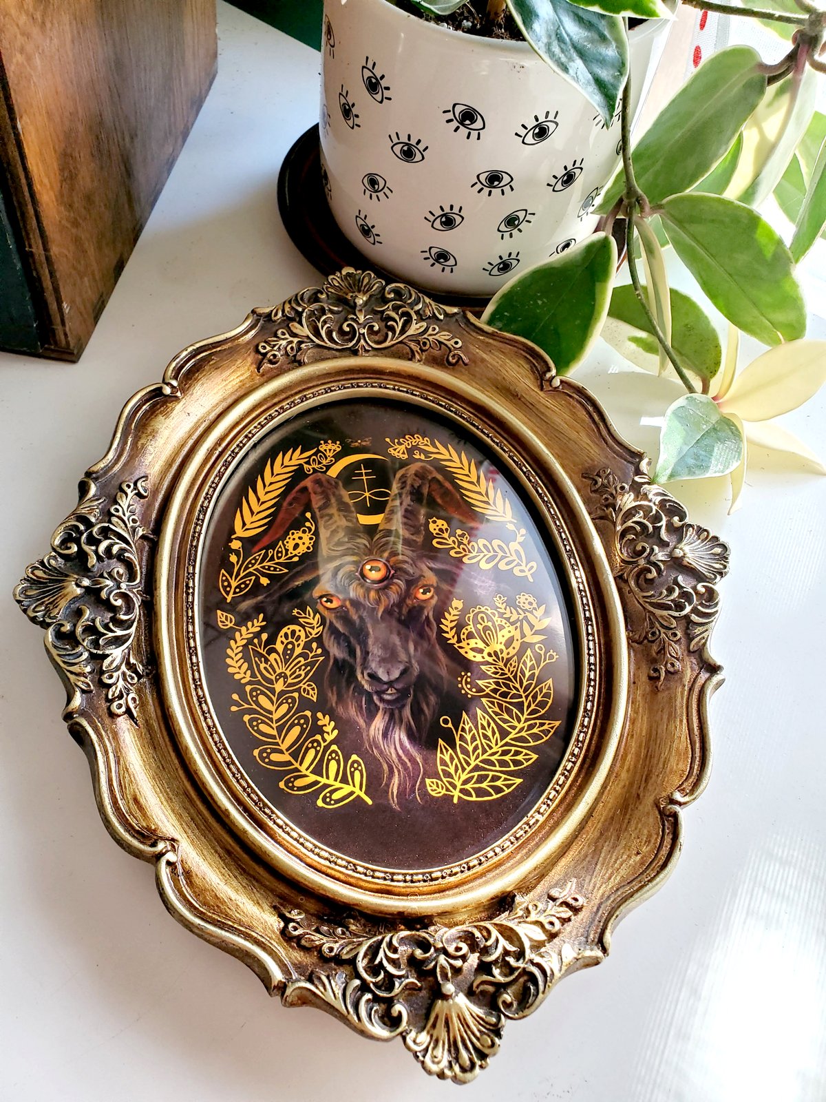 Black Goat in antiqued oval frame | Mheld