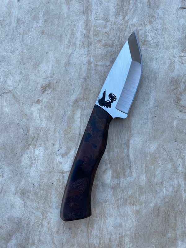 Image of Merc with rag micarta