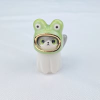 Image 1 of Gray and white cat with frog hat ceramic figurine