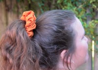 Image 2 of sandy espooky scrunchie