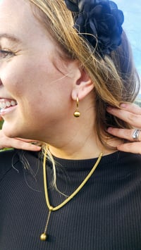 Image 2 of Huggie Gold Ball Earrungs 