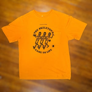 THE NIGHT THE SKELETONS CAME TO LIFE-ORANGE LARGE POCKET TEE