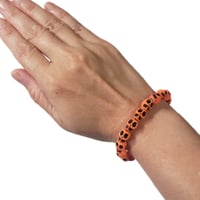 Image 1 of Orange Skull Bracelet  (Size Small)
