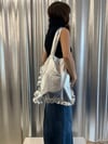 Silver tote bag with ruffles