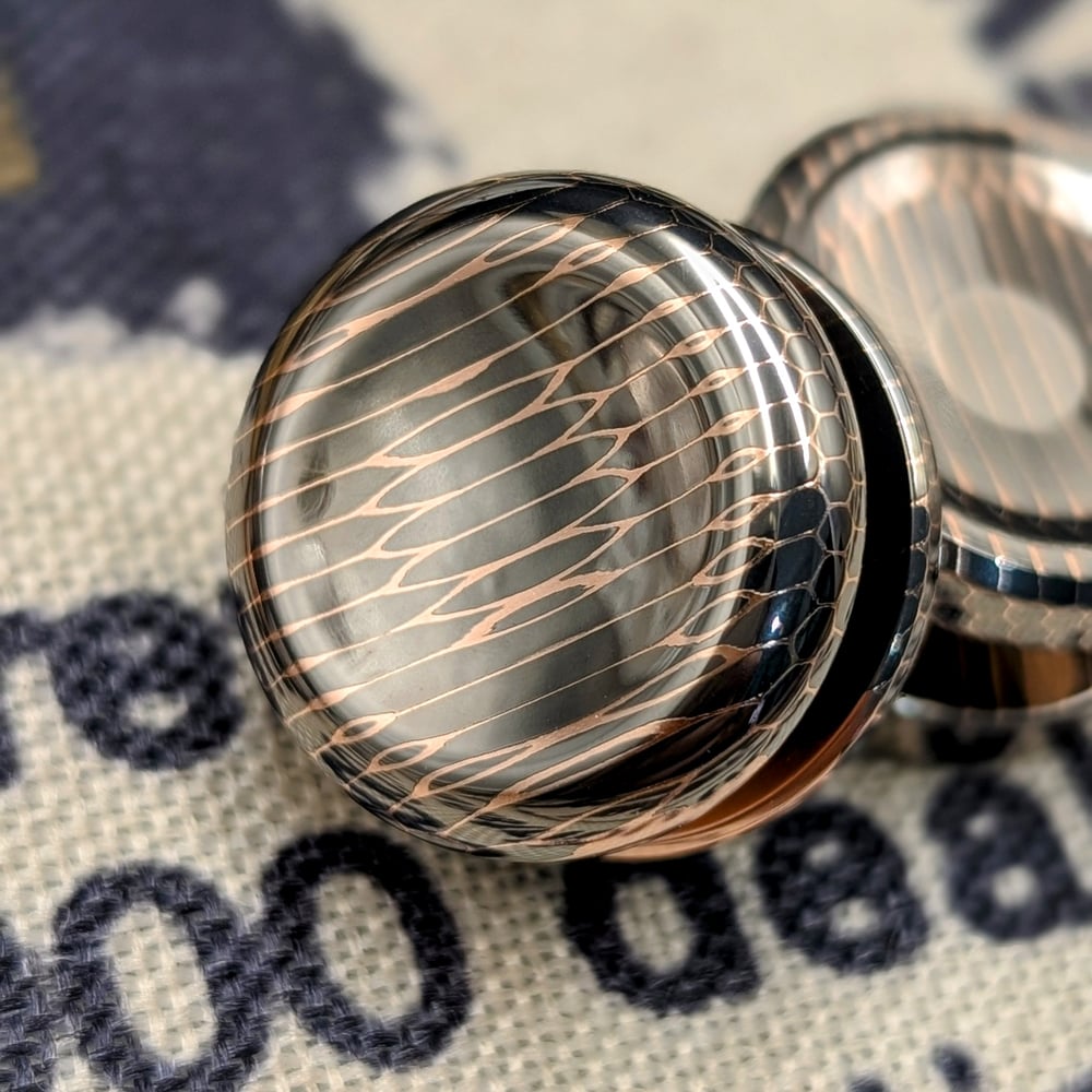 Button out of High Filament Superconductor Vertical Cut