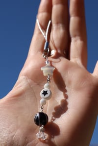 Image 1 of black and white keychain