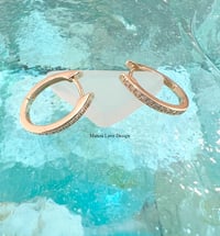 14k solid gold diamond oval hoop earrings 