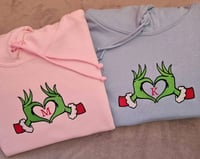 Personalised initial into Grinch's hand