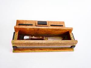 Image of Oak wood Keepsake Box accented with exotic Black Palmm edged with band saw blade, Wood Knife Box