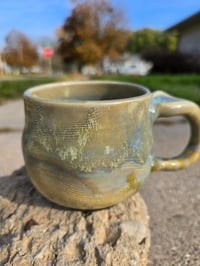 Image 2 of Big Golden Haze Mug- with black footed bottom