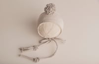 LILA hat with pom