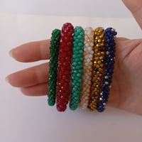 Flexible Bracelet from Faceted Crystal Emerald Green, Dark Red, Turquoise, Montana Blue Faceted Bead